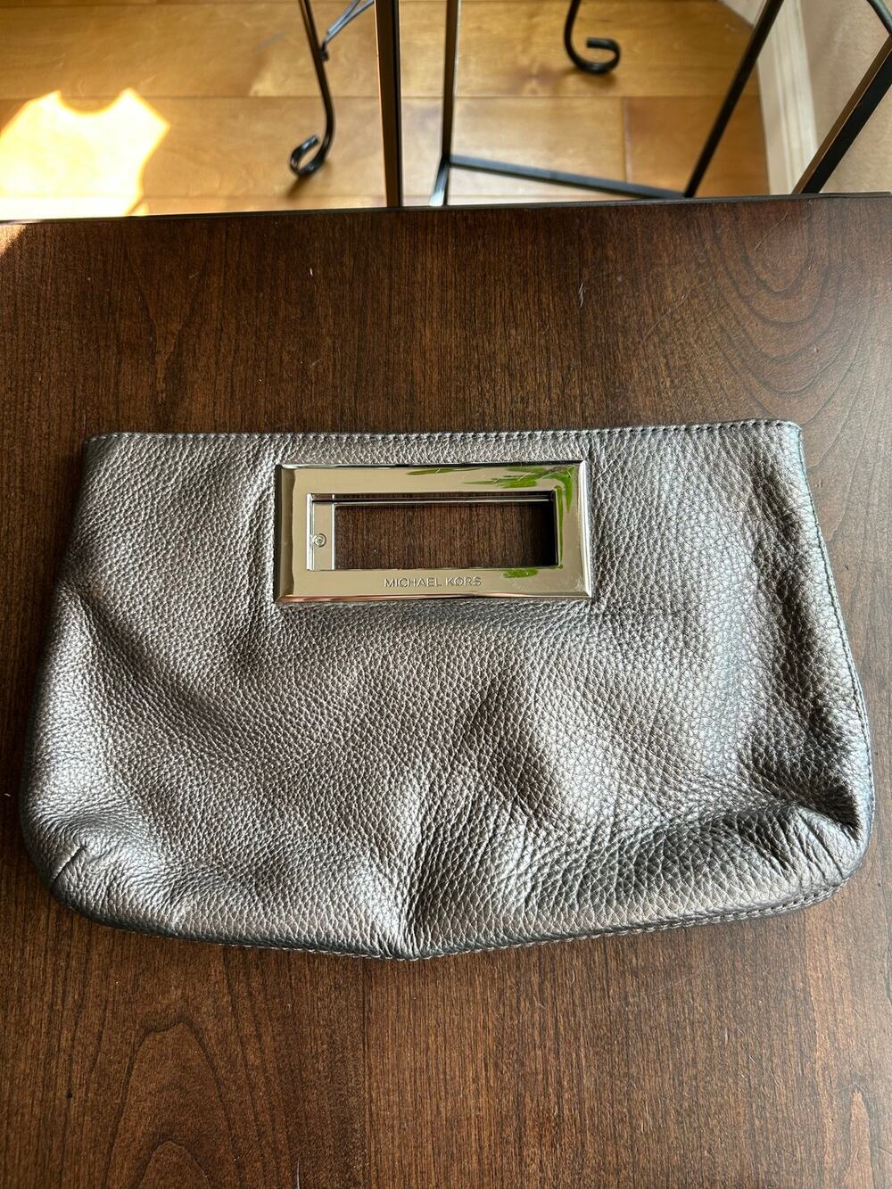 Michael Kors Metallic Pewter Leather Berkley Clutch featuring textured metallic